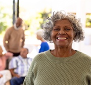 Closeup of woman smiling outside with friends